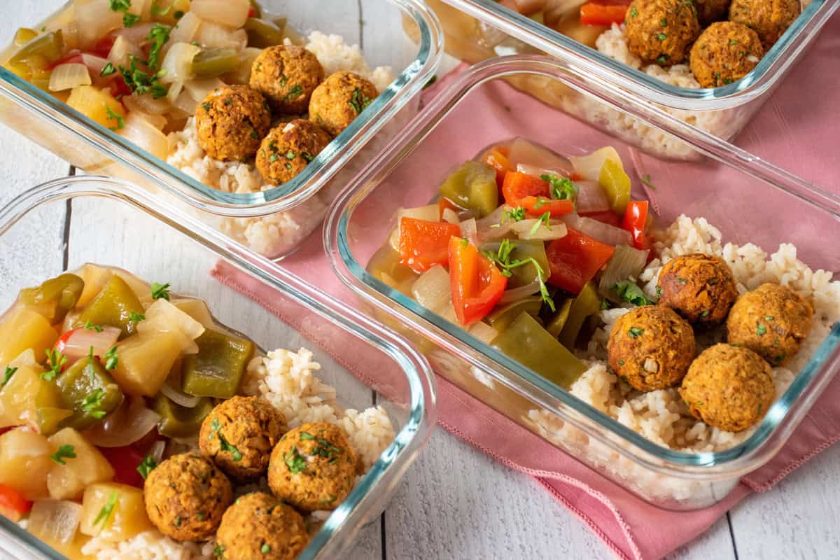 sweet and sour vegetarian meatballs in meal prep containers.