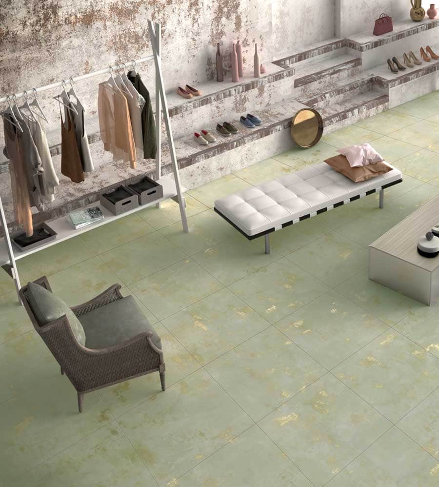 Modern boutique interior with clothing display and seating area.