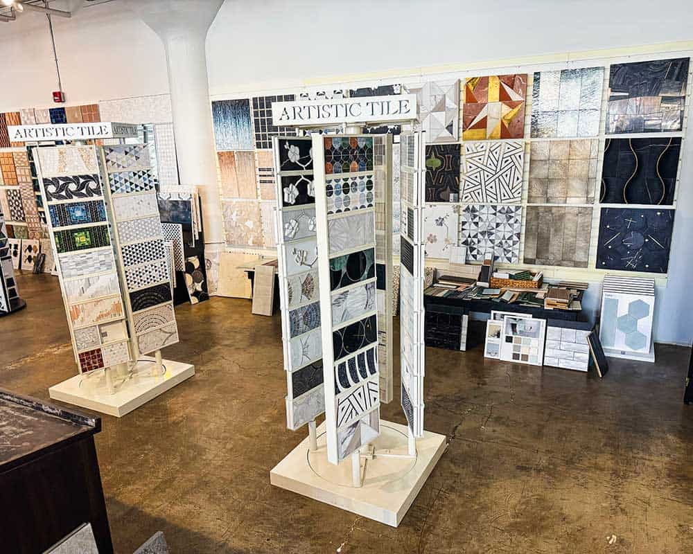 Display of artistic tiles at Bella Pietra Design showroom.
