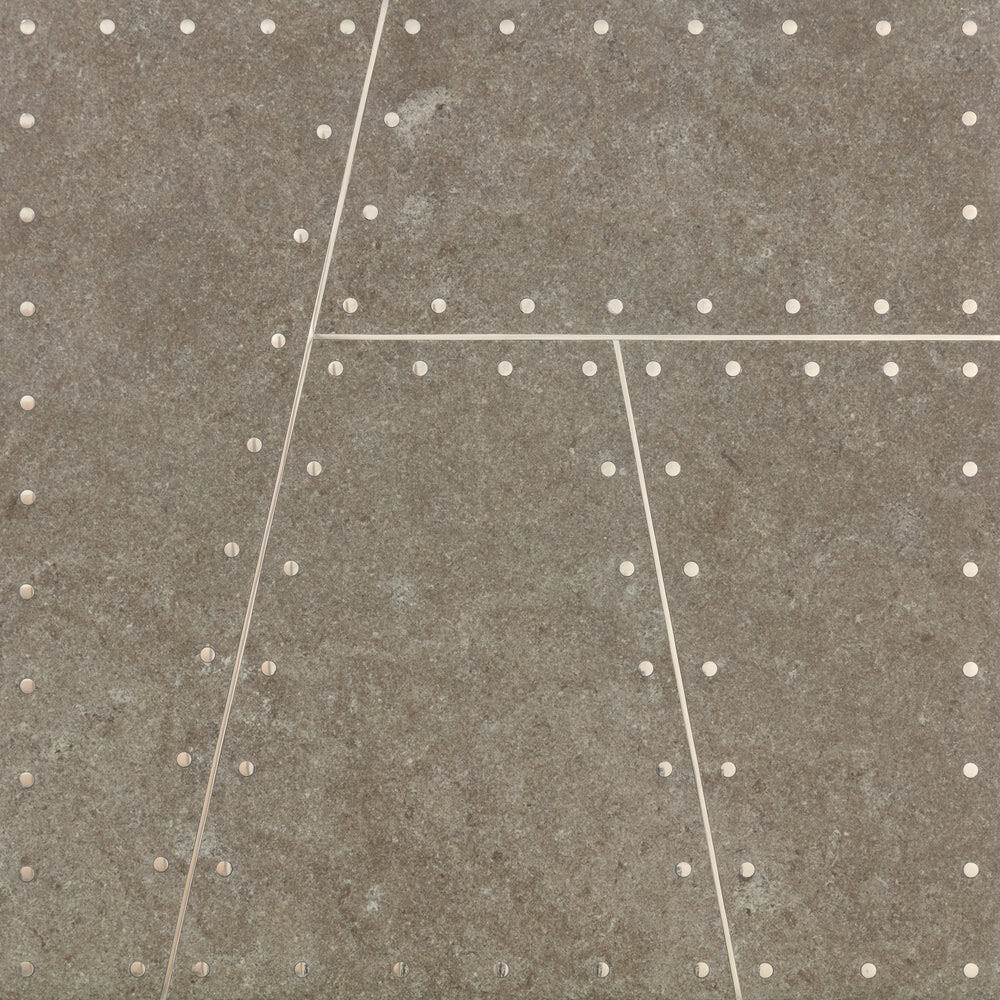 Close-up of textured tile with dotted pattern for interior design.