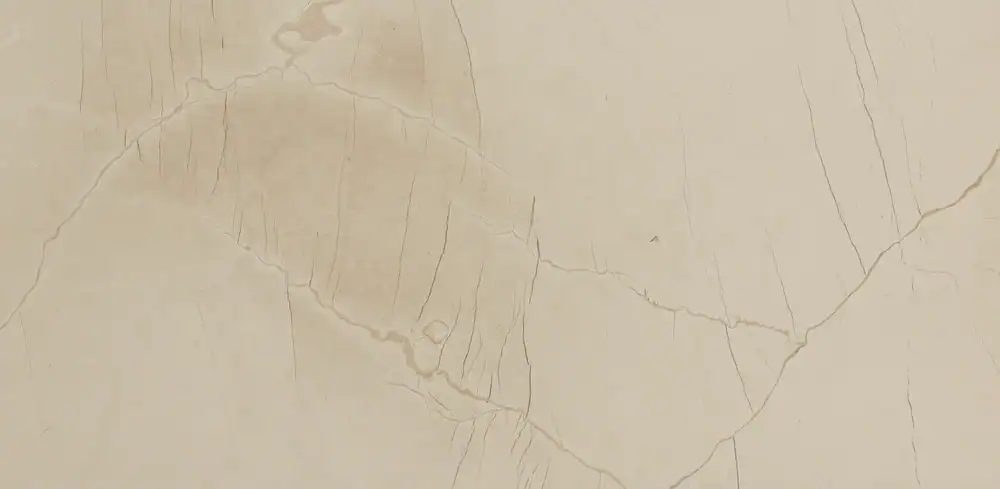 Close-up of beige marble surface with subtle veining.