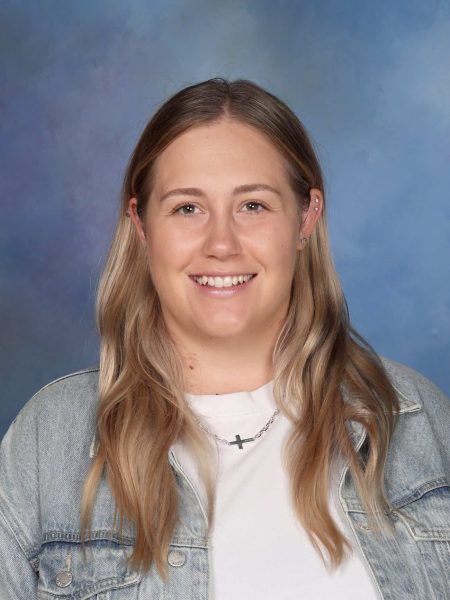 Monique Hickin smiling at Bell Block School, New Zealand.
