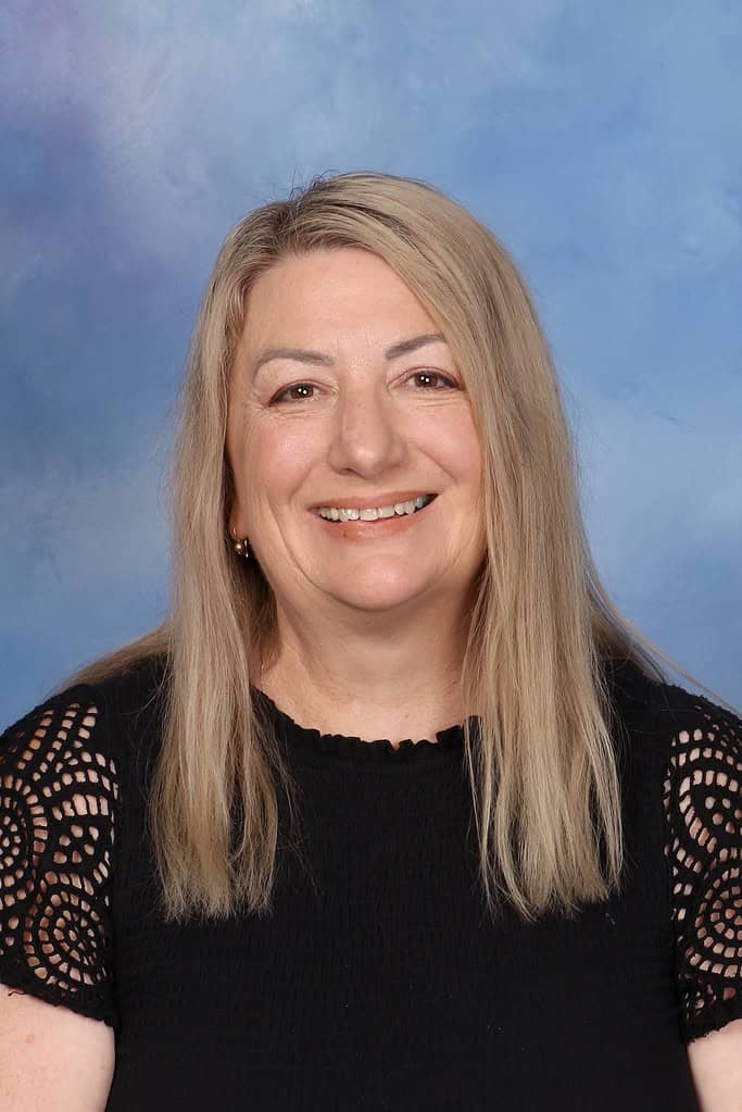 Professional portrait of a smiling woman, staff member at Bell Block School in New Zealand.