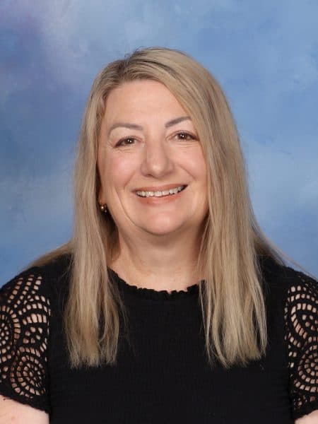 Professional portrait of a smiling woman, staff member at Bell Block School in New Zealand.