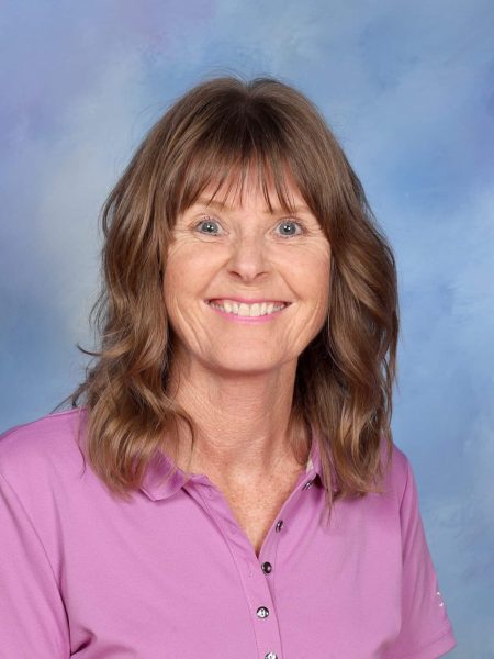 Robyn Jourdain, staff member at Bell Block School, smiling in a pink shirt.