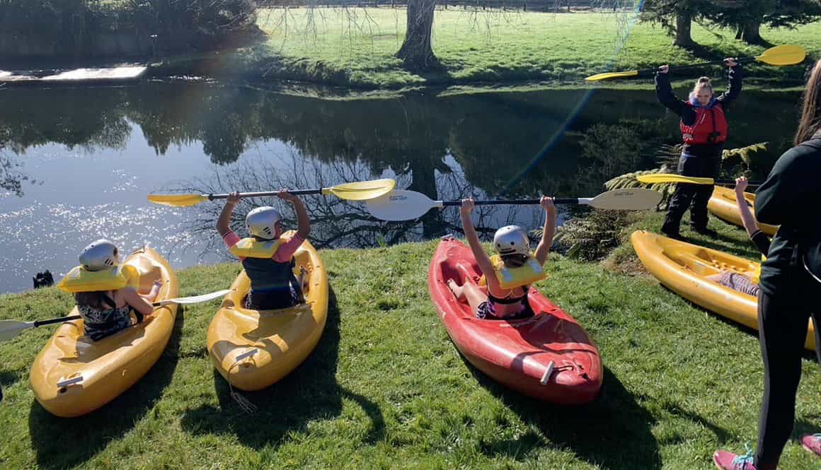 Kayaking on the water at Bell Block School outdoor activity.