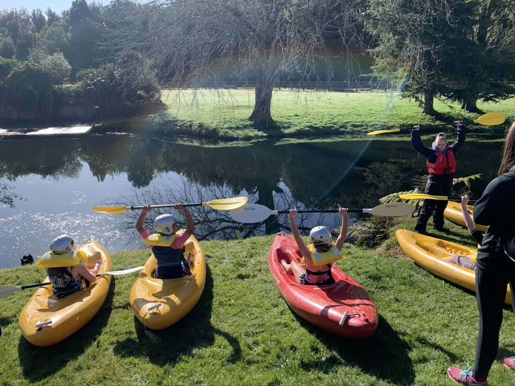 Kayaking on the water at Bell Block School outdoor activity.