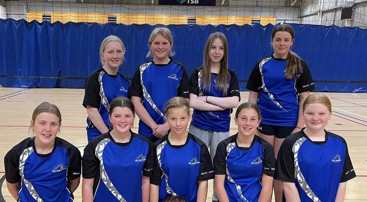 Volleyball 2022 Bell Block School netball team in sports uniforms inside gymnasium, representing primary school sports.