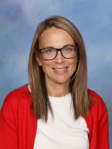 Friendly female teacher at Bell Block School, New Zealand, in classroom or teacher portrait.
