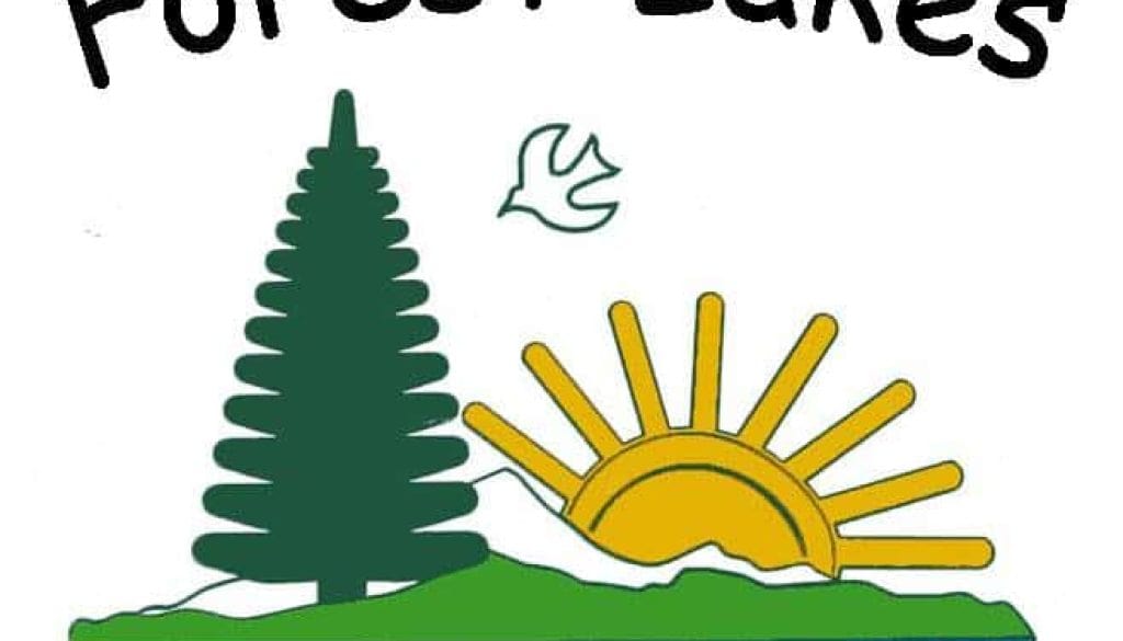 Forest Lakes School logo with sun, tree, and water scenery, representing outdoor learning environment.