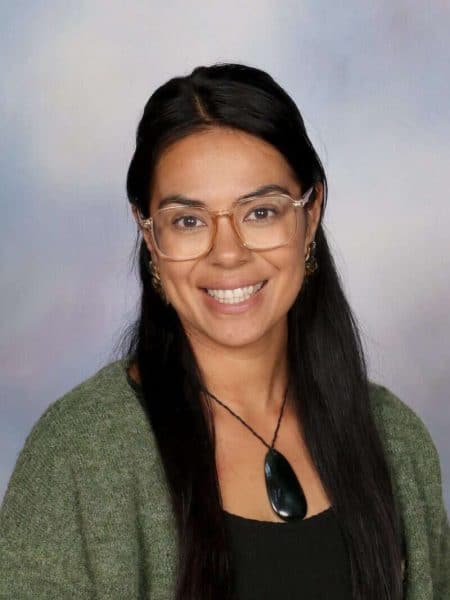 Friendly teacher at Bell Block School in New Zealand, fostering a positive learning environment.