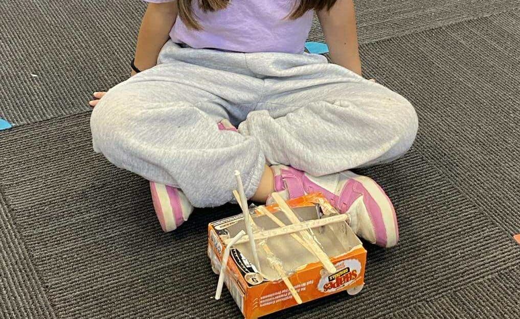 548776802_1090271123258153_4874029316762645272_n Creative student project at Bell Block School involving a homemade robot made from a food container and sticks.