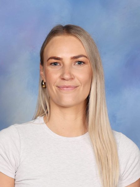 Cerise Smith, a teacher at Bell Block School, smiling in her classroom.