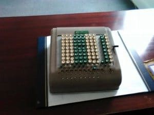 Old mechanical calculator used for accounting and calculations from the late 20th century.