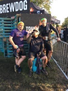 Group of three men wearing headbands at Tough Mudder race.