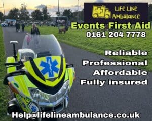 Ambulance motorcycle with blue star of life symbol in foreground.