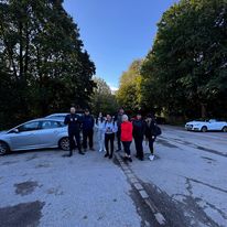 Group of Bennett Staff members outdoors in a parking area.