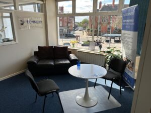 Interior view of Bennett Staff office with seating area and large window.