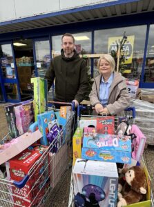 Dedicated staff member assisting at the 2024-2025 sale event.