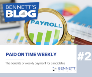 Magnifying glass over payroll chart highlighting weekly pay advantages.