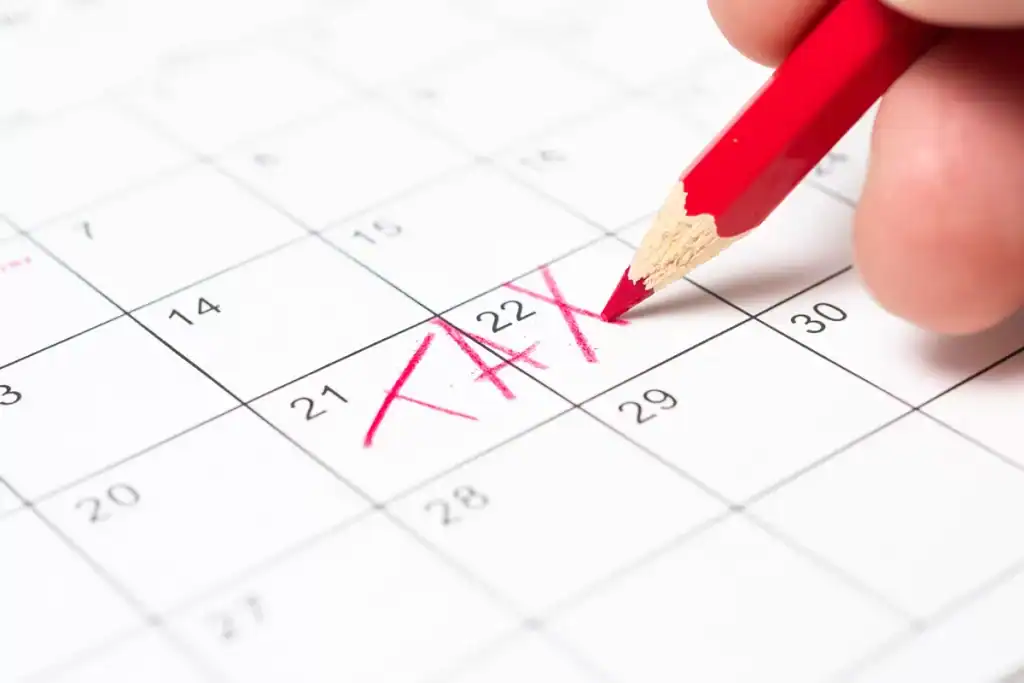 Calendar with "Tax" written in red marker on the 22nd.