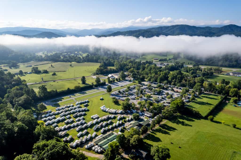 An aerial view of an rv park in the mountains.