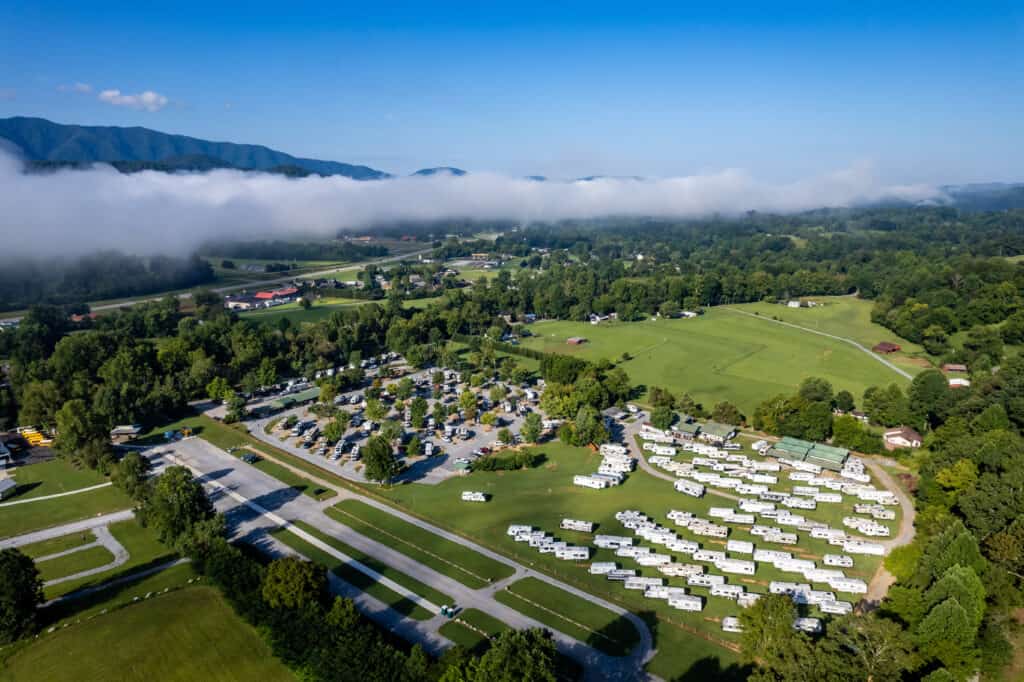 An aerial view of an rv park in the mountains.