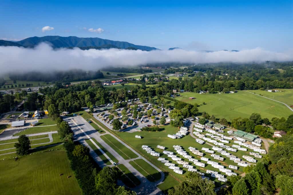 An aerial view of an rv park in the mountains.