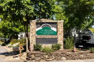 An rv park with a sign in front of it.