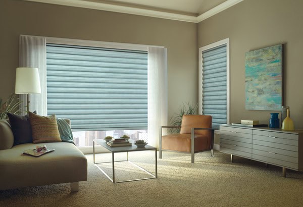 Light-filtering blinds in a modern living room with neutral decor and natural light, ideal for privacy and style.