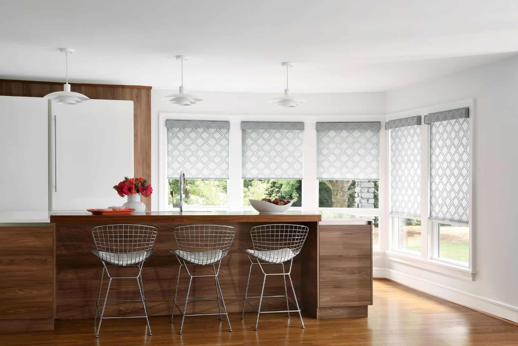Bright modern kitchen with large windows, white blinds, and wooden accents, designed for accessibility with Blind Magic solutions.