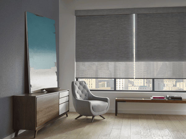 Soft gray window blinds controlling natural light in modern interior space.