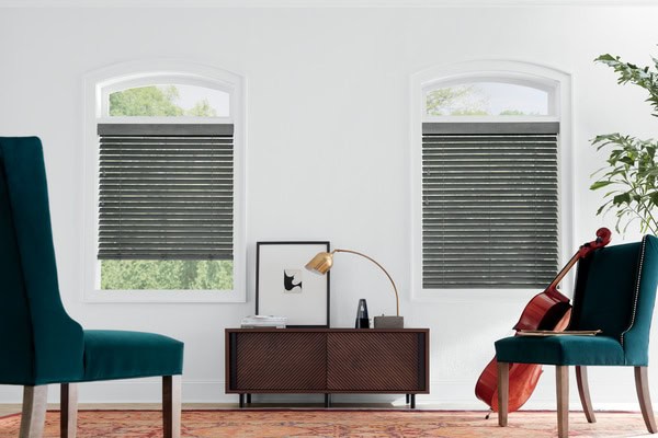 Custom blackout window blinds in a modern living room setting.