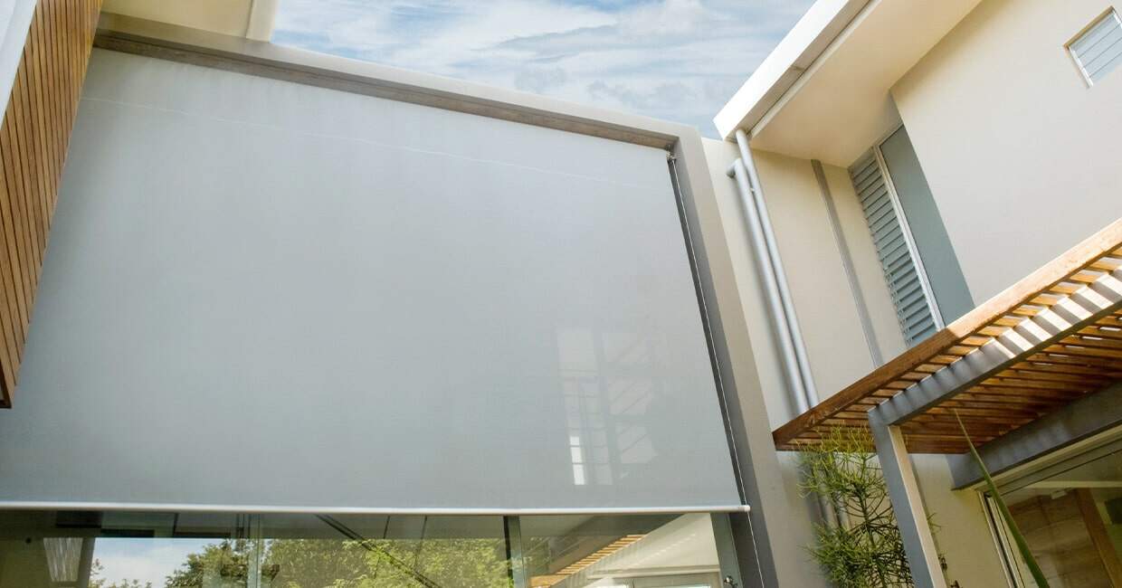 Motorized adjustable outdoor privacy screen for modern homes.