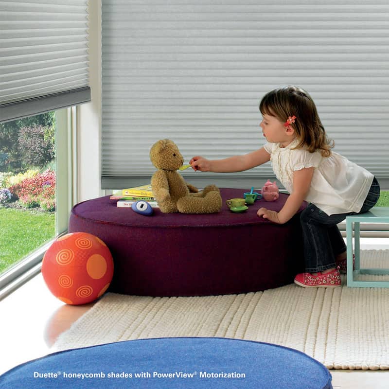 Soft honeycomb blackout shades with PowerView motorization by Blind Magic.