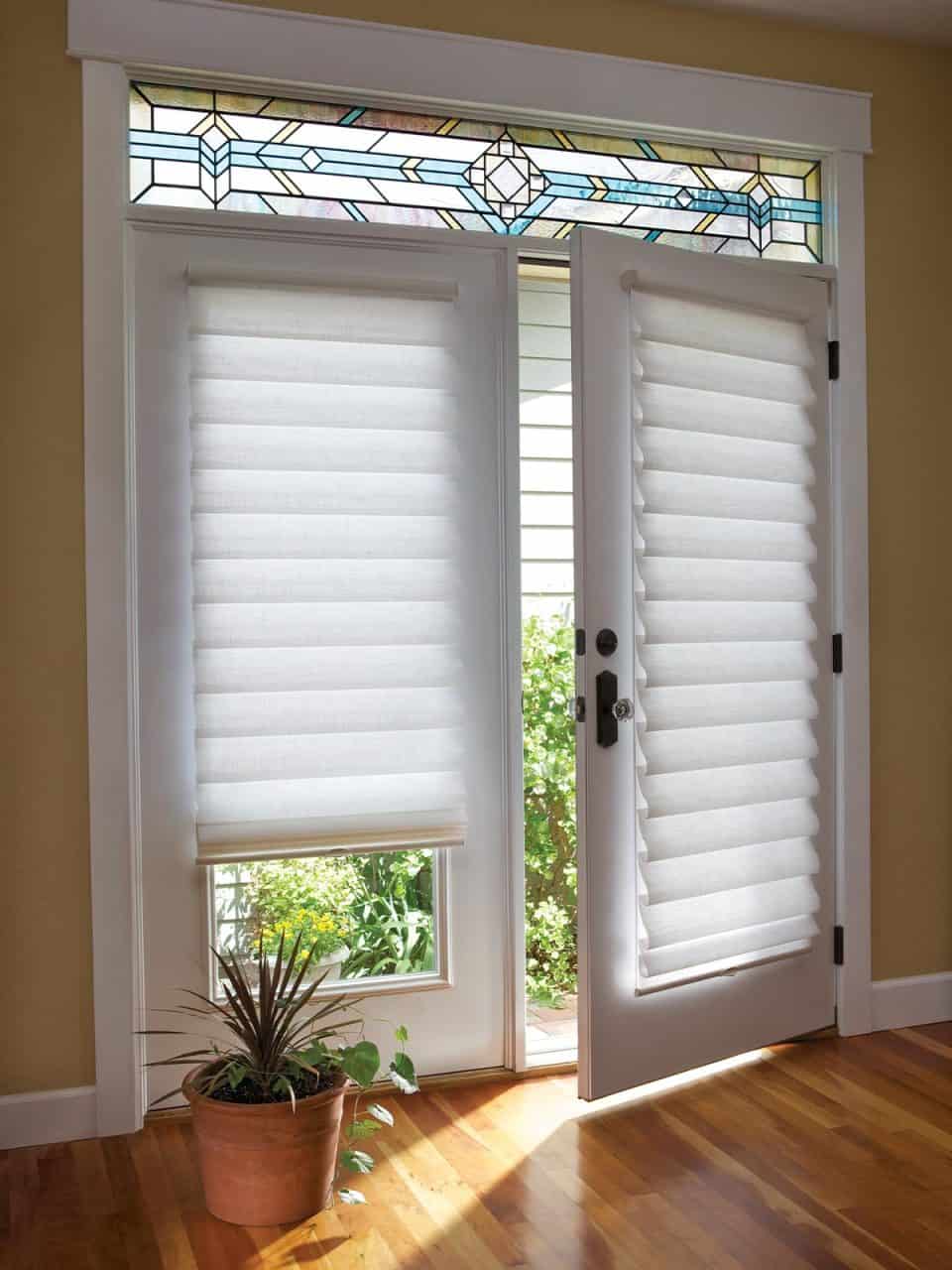 Custom white window blinds and stained glass transom window, interior door with window blinds, natural light, home décor.