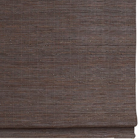 Dark brown woven window covering with textured fabric for privacy and light control.