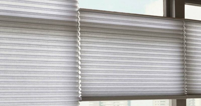 Sleek white adjustable window blinds for modern interior control.