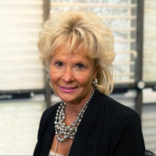 Elegant woman in professional attire, marketing blinds at Blind Magic.