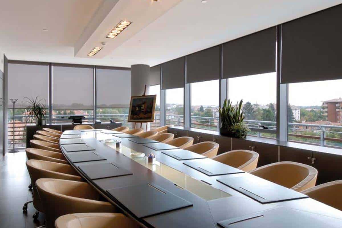 Modern office conference room with blackout blinds for privacy and light control.