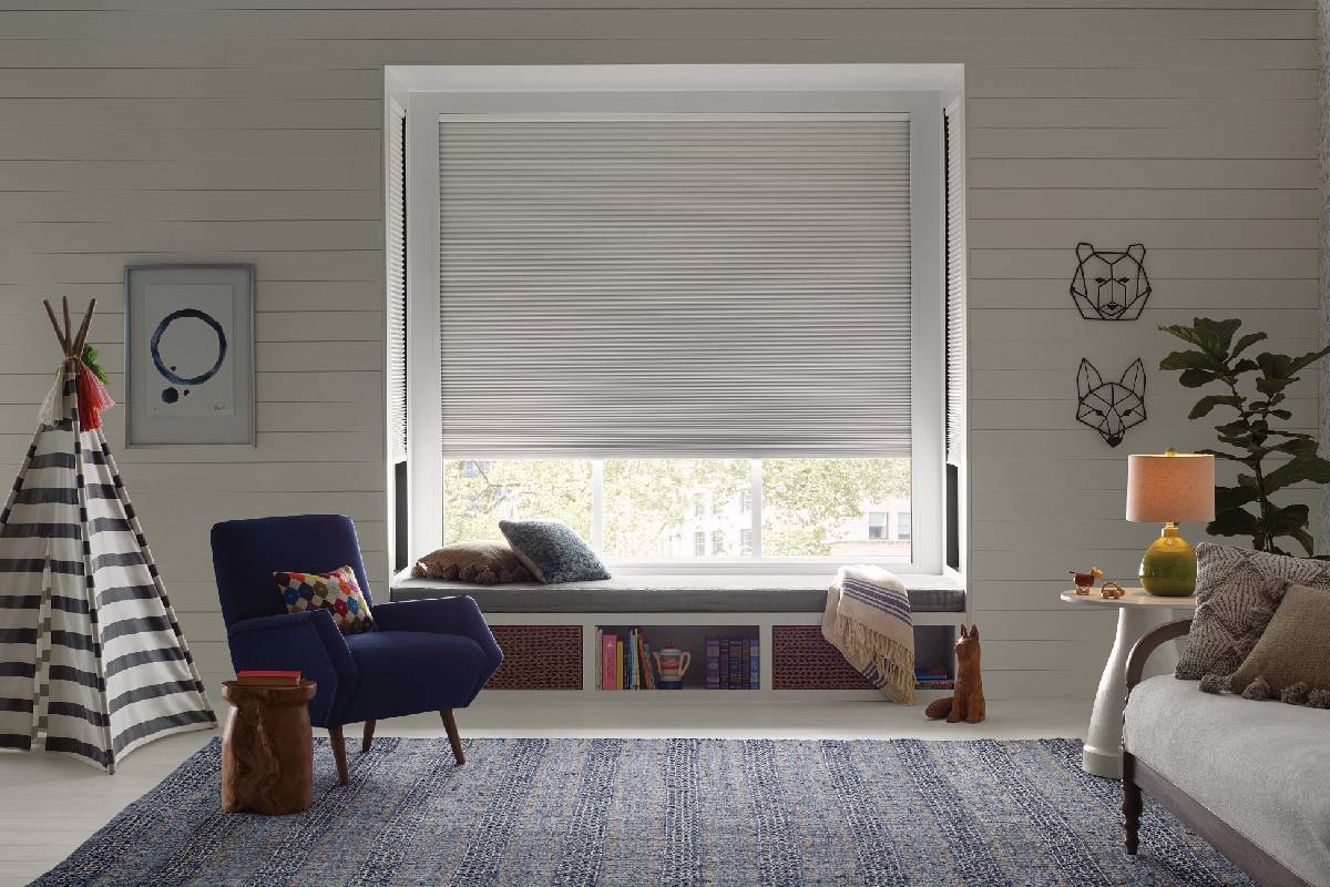 Ceiling-mounted motorized window blind with light filtering for privacy and energy efficiency.