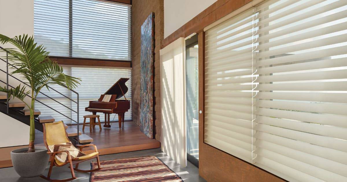Soft horizontal blinds and window treatments at Blind Magic, enhancing light control and privacy in stylish home interiors.