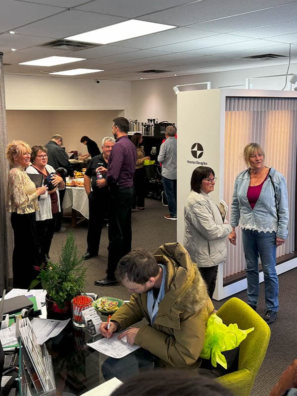 Modern office meeting room with people socializing and networking.