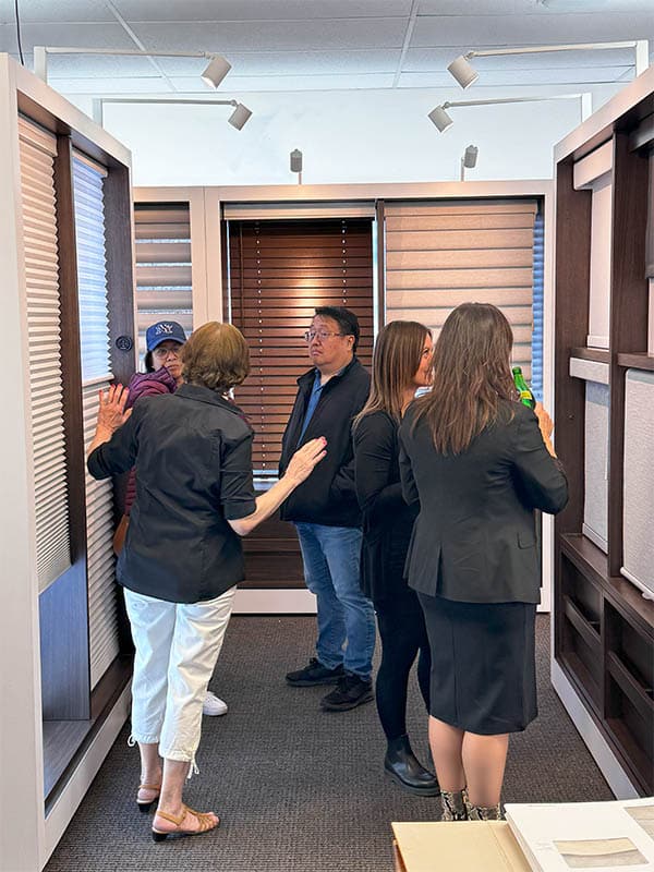 Custom window treatment solutions consultation with professionals at Blind Magic showroom in Canada.