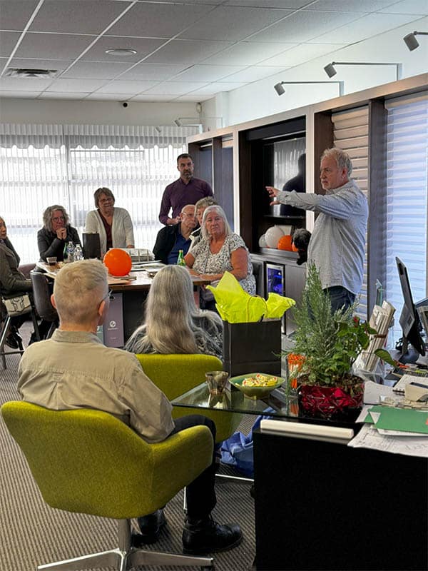 Hands-free adaptive tech demonstration for visually impaired at Blind Magic event.