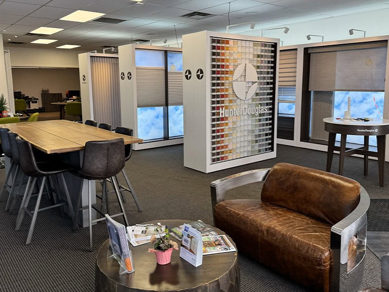 Color sample display wall at Blind Magic office showcasing window treatment solutions.