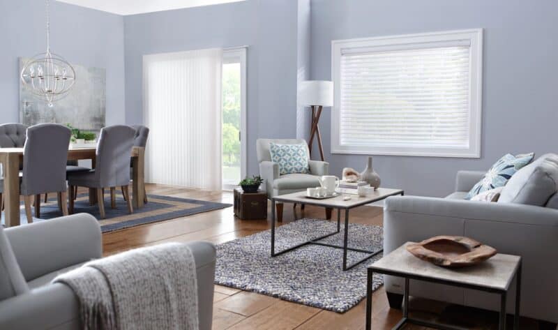 Bright living room with stylish blinds on windows, cozy seating, and modern decor for enhanced home comfort.