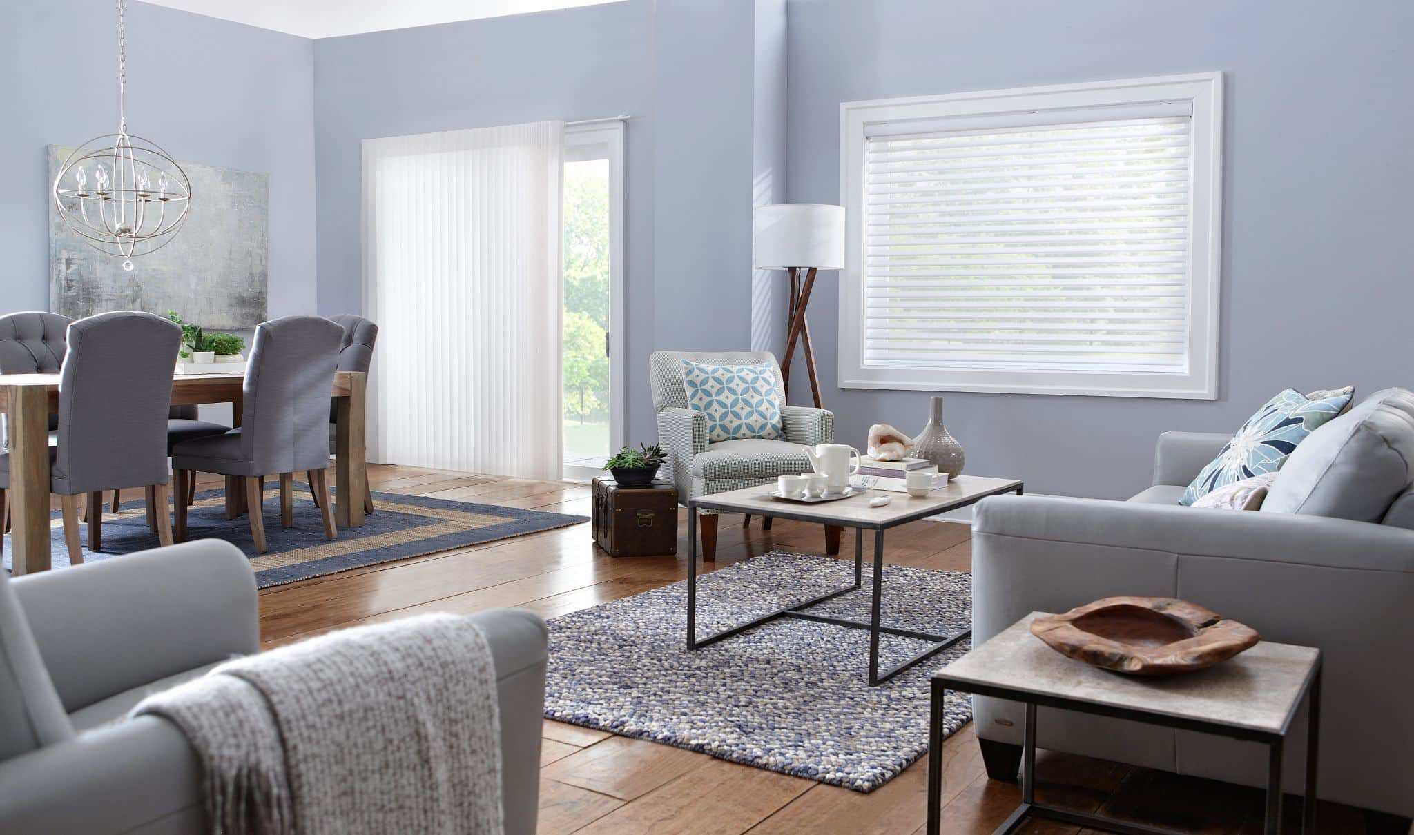 Bright living room with stylish blinds on windows, cozy seating, and modern decor for enhanced home comfort.