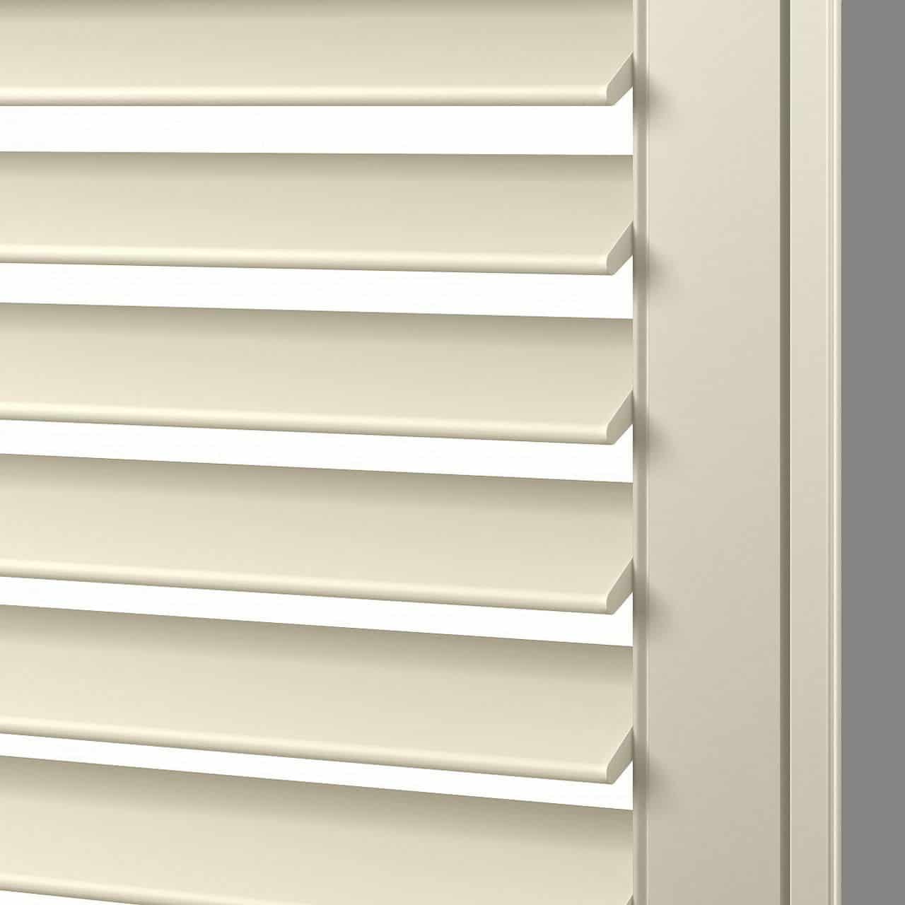 Bright beige horizontal window blinds with adjustable slats, ideal for controlling light and airflow in residential or office spaces.