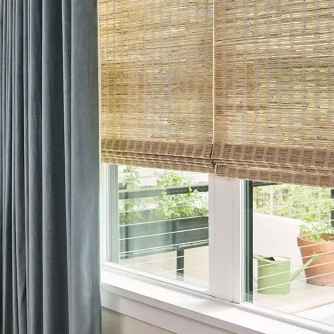 Light-filtering bamboo and black blackout curtains for windows.